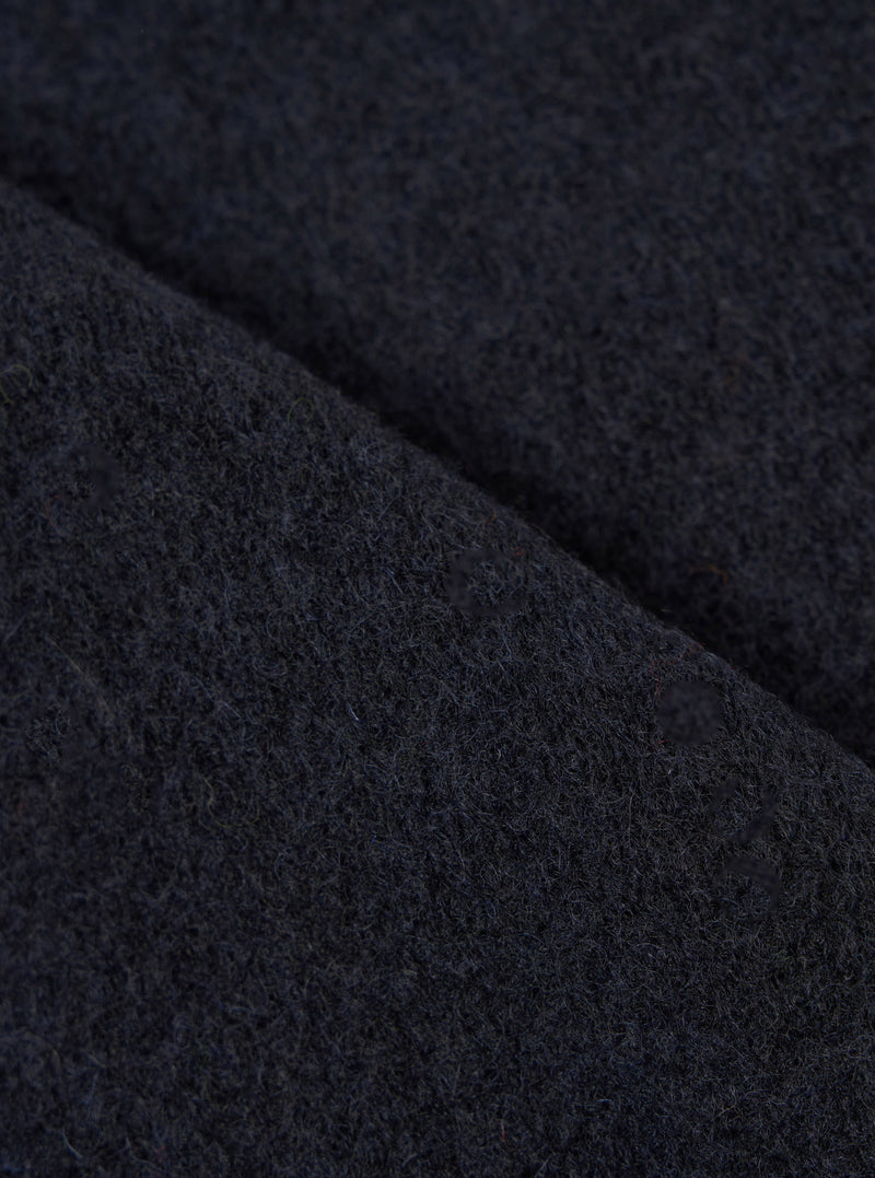 Extreme close-up fabric swatch image showcasing the texture of the Navy Wool Fleece Zip Waistcoat. The detailed shot highlights the rich navy blue tone, soft fibers, and cozy tactile feel of the wool fleece material.