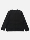 The Black Wool Fleece Cardigan is laid flat on a white background. The cardigan is a dark black color and appears to be made of a soft, fleece-like material.