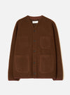Cacao brown wool fleece cardigan on a plain light grey studio backdrop, no model. V-neckline with a darker brown knit trim visible at collar and cuffs. Five dark buttons down the centre front. Four patch pockets: two chest, two lower. Textured boiled wool fleece fabric throughout. Universal Works woven label at the neck.