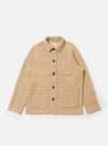 The Fawn Wool Fleece Field Jacket is displayed on a white background. The jacket is a light tan color and has a relaxed fit with button closure and patch pockets.