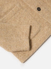 Close-up of the fawn wool fleece Field Jacket on a white background, showing the sleeve, pocket detail, and button.