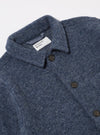 Close-up of the Slate Blue Wool Fleece Field Jacket on a white background. The jacket features dark buttons and a visible brand label.