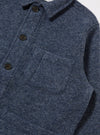 Close-up of the Slate Blue Wool Fleece Field Jacket. The jacket is made of a soft, textured wool fleece and has a relaxed fit. Shot against a white backdrop.