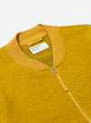 Close-up of the Yellow Wool Fleece Zip Bomber on a white background. The jacket features a zip closure and a ribbed collar.