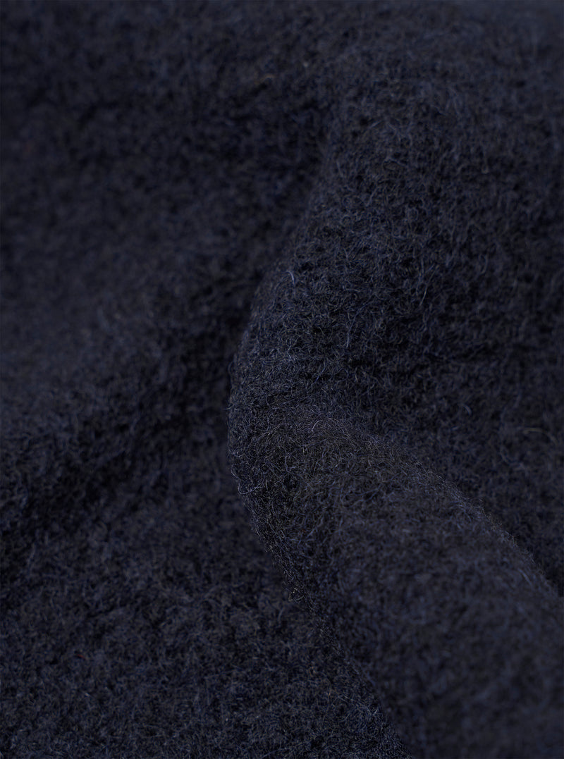 Macro swatch image showcasing the rich texture of the Navy Wool Fleece Zip Liner Jacket fabric. The close-up shot emphasizes the dense, soft deep navy wool fleece fibers and tactile weave of the material up close.