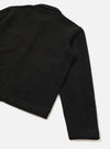 Close-up flat lay of a black wool fleece uniform jacket on a white studio surface, showing the back and one sleeve. The textured fleece fabric is visible across the body and sleeve. A ribbed cuff finishes the sleeve hem, and a wide ribbed band runs along the jacket's lower hem.