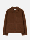 Cacao brown wool fleece uniform jacket laid flat on a light grey studio backdrop. Features a spread collar with a Universal Works woven label, a single-breasted button placket with six dark buttons, one chest patch pocket, two large lower patch pockets, and ribbed cuffs and hem.