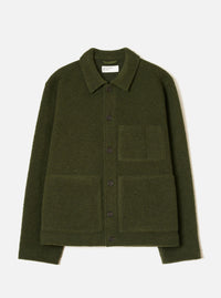 Olive wool fleece uniform jacket laid flat on a light grey studio backdrop. Features a pointed collar, five dark buttons down the centre front, one chest patch pocket and two large lower patch pockets. Ribbed cuffs and a straight hem are visible. A Universal Works woven label sits inside the collar.