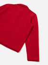 Close-up flat lay of a scarlet wool fleece uniform jacket on a light grey seamless surface. The shot shows the back shoulder, one full sleeve, and the cropped hem. The fabric has a dense, lightly brushed texture. A small collar is visible at the top. The ribbed cuff sits at the sleeve end.