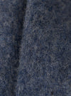 Close-up of the Slate Blue Wool Fleece Uniform Jacket, showing the texture and color of the wool fleece material. The background is a plain surface.