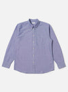 The Blue Oxford Daybrook Shirt is laid flat on a white background. The long-sleeved shirt is buttoned and has a chest pocket. The material is a textured blue oxford cloth.