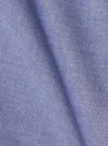 Close-up of the fabric of the Blue Oxford Daybrook Shirt. The material is a textured blue and white weave. The shirt is displayed on a plain background.
