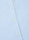 Close-up of the Sky Blue Oxford Daybrook Shirt showing the light blue oxford cloth and button placket with white buttons. Shot on a white surface.