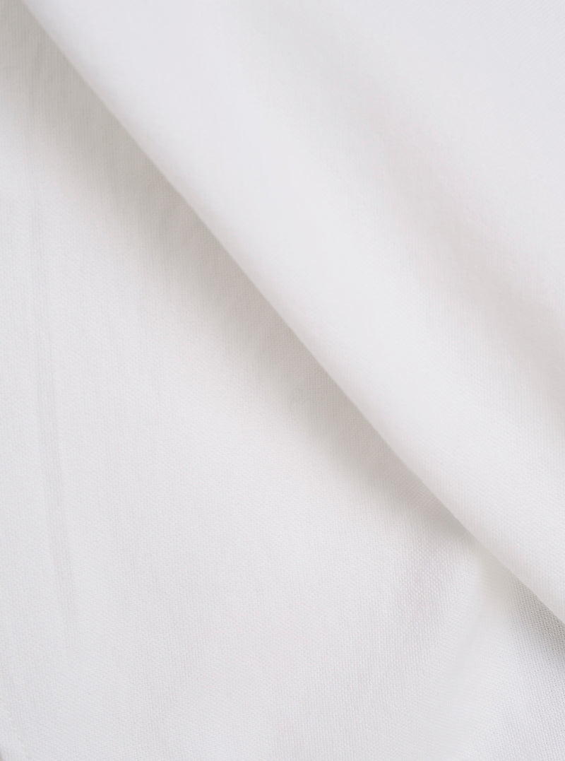 Extreme close-up fabric swatch image showcasing the texture of the White Oxford Daybrook Shirt. The detailed macro view highlights the clean white fibers and characteristic basketweave pattern of the organic oxford cotton.