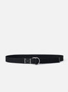 The Black Canvas Webbing O Ring Belt is shown as a flat lay against a white background. The belt is made of a black woven fabric and features two silver-tone metal O-rings at one end for closure.