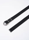 The Black Canvas Webbing O Ring Belt is shown as a flat lay against a white background. The belt features a black woven fabric strap and two silver metal O-ring buckles at one end. The belt is coiled to display its length and texture.