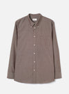 Front view of the Brown Prince Chambray Daybrook Shirt laid flat on a light grey studio backdrop. Features a spread collar, button-up front closure, single chest patch pocket, and long sleeves with buttoned cuffs. No model or mannequin present.