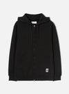 Black zip-through hoodie in brushback sweat fabric, laid flat on a white studio backdrop. Features a jersey-lined hood with navy drawcords, a full-length metal zip, two large patch pockets, and ribbed cuffs and hem. A small woven UW brand label sits at the lower right front.