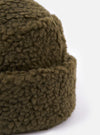 Close-up of the cableami® Olive Toque Boa Cap, showcasing its soft, textured olive-green material. The image is set against a clean, white background.