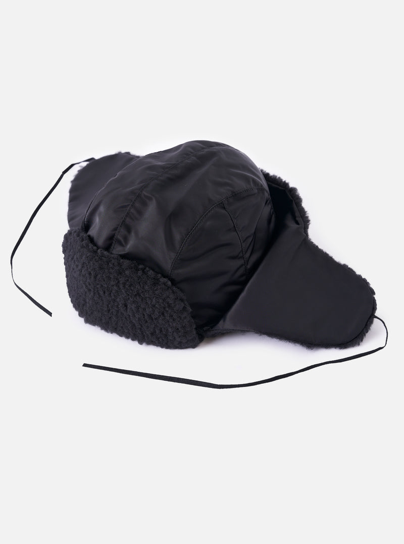 cableami® Black Military Nylon Twill Boa Aviator hat on a white background. The hat is black nylon with boa trim and ear flaps with ties.