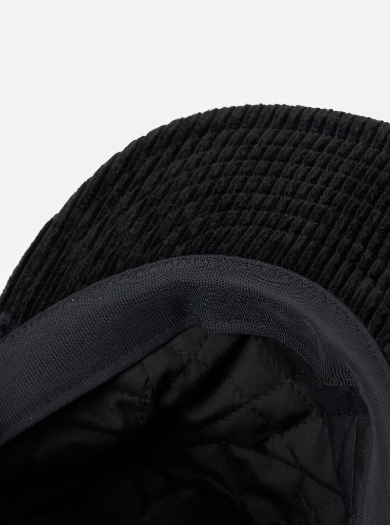 Close-up of the inside of the cableami® Black Corduroy 5w Cap, showing the quilted lining and corduroy texture against a plain white background.