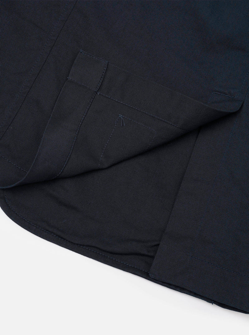 Close-up image of the Navy Twill London Jacket against a plain white background, focusing on the dark navy blue twill weave texture, front button closure, precise stitching, and tailored collar detail.