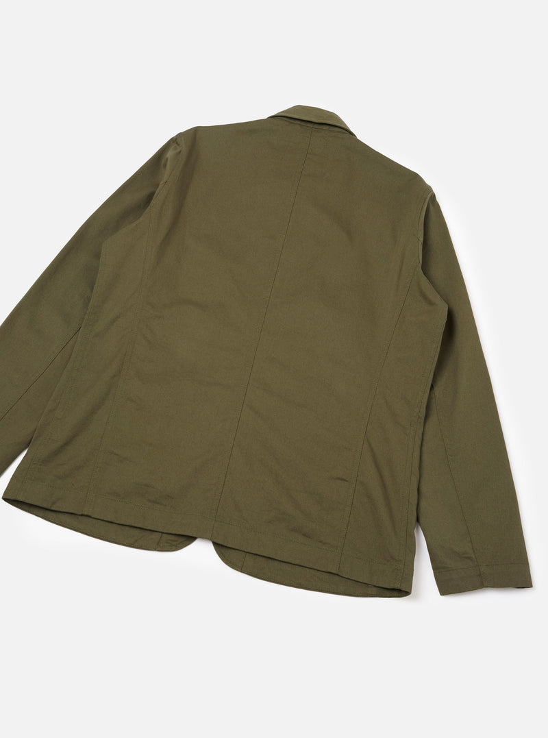 Rear view of the Light Olive Twill Bakers Chore Jacket displayed flat on a plain light background, showing the light olive green twill back section, sturdy hem construction, and casual utility jacket cut.