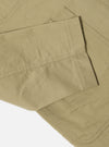 Close-up of the sand twill Bakers Jacket on a white background. The jacket is made of a light brown twill fabric, with visible seams and stitching.