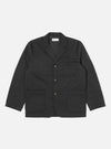 The Black Twill Three Button Jacket is displayed on a white background. The jacket is dark, with three brown buttons and patch pockets.