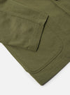 Close-up of the light olive twill three button jacket showing the sleeve and pocket detail. The jacket is on a white background.