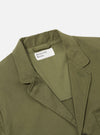Close-up of the light olive twill three button jacket on a white background. The jacket's collar and lapel are visible, showcasing the twill texture.