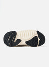 Close-up of the sole of a Flower Mountain Dove Hairy Velour/Suede Wave Man shoe. The sole is off-white with black rubber sections. Shot on a white background.