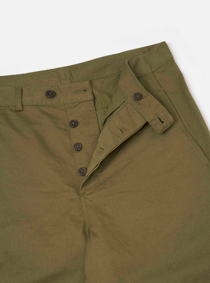 Detail shot of the Light Olive Twill Curved Pant displayed on a clean white background. Highlights the fine twill fabric texture, precise seam stitching, side pocket construction, and comfortable loose fit structure.