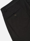 Close-up of the Black Twill Aston Pant on a white background. Shows the back pocket with button closure and twill fabric detail.
