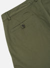 Close-up of the light olive twill Aston Pant showing the back pocket detail and material texture against a white background.