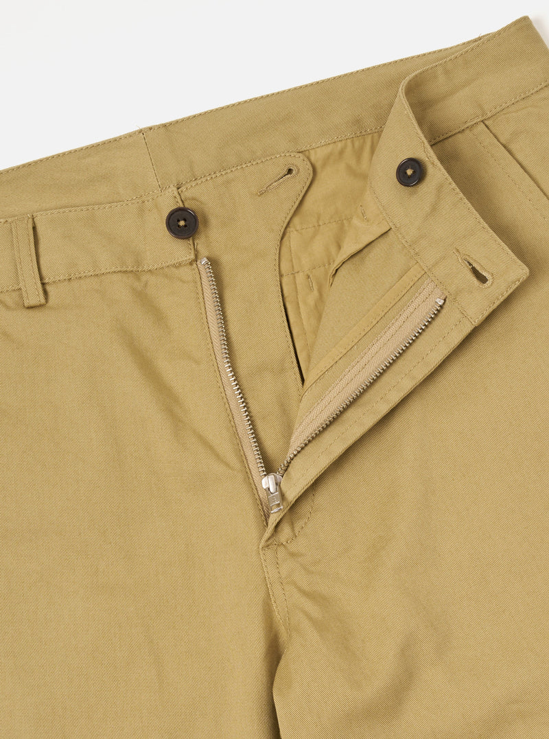 Close-up rear detail shot of the Sand Twill Aston Pant set against a clean white backdrop. Highlights the rear flap pockets with button fastenings, clean tailored seams, and fine sand-colored 3/1 cotton twill weave fabric.