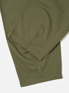 Close-up of the Light Olive Twill Fatigue Pant on a white surface. The twill fabric is visible, showcasing the texture and color of the pants.