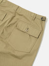 Close-up of the back of the Sand Twill Fatigue Pant on a white background. The twill fabric is a light tan color. Features a buttoned pocket and adjustable belt.