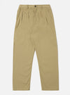 Studio shot of the Sand Twill Double Pleat Pant. The pants are sand-colored and made of twill. They have a double pleat and are laid out on a white background.