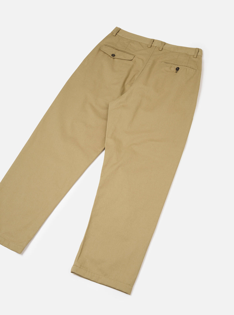 Rear view of the Sand Twill Double Pleat Pant set against a clean white backdrop. Highlights the relaxed wide fit, rear buttoned welt pockets, neat waistband stitching, and durable sand-coloured twill fabric.
