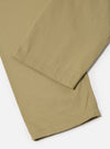 Close-up of the sand twill double pleat pant on a white background. The twill fabric is visible, showcasing the texture and construction of the pant.