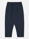 Studio shot of the Navy Twill Pleated Track Pant on a white background. The pants are a dark navy color and have a relaxed fit with pleats at the waist.