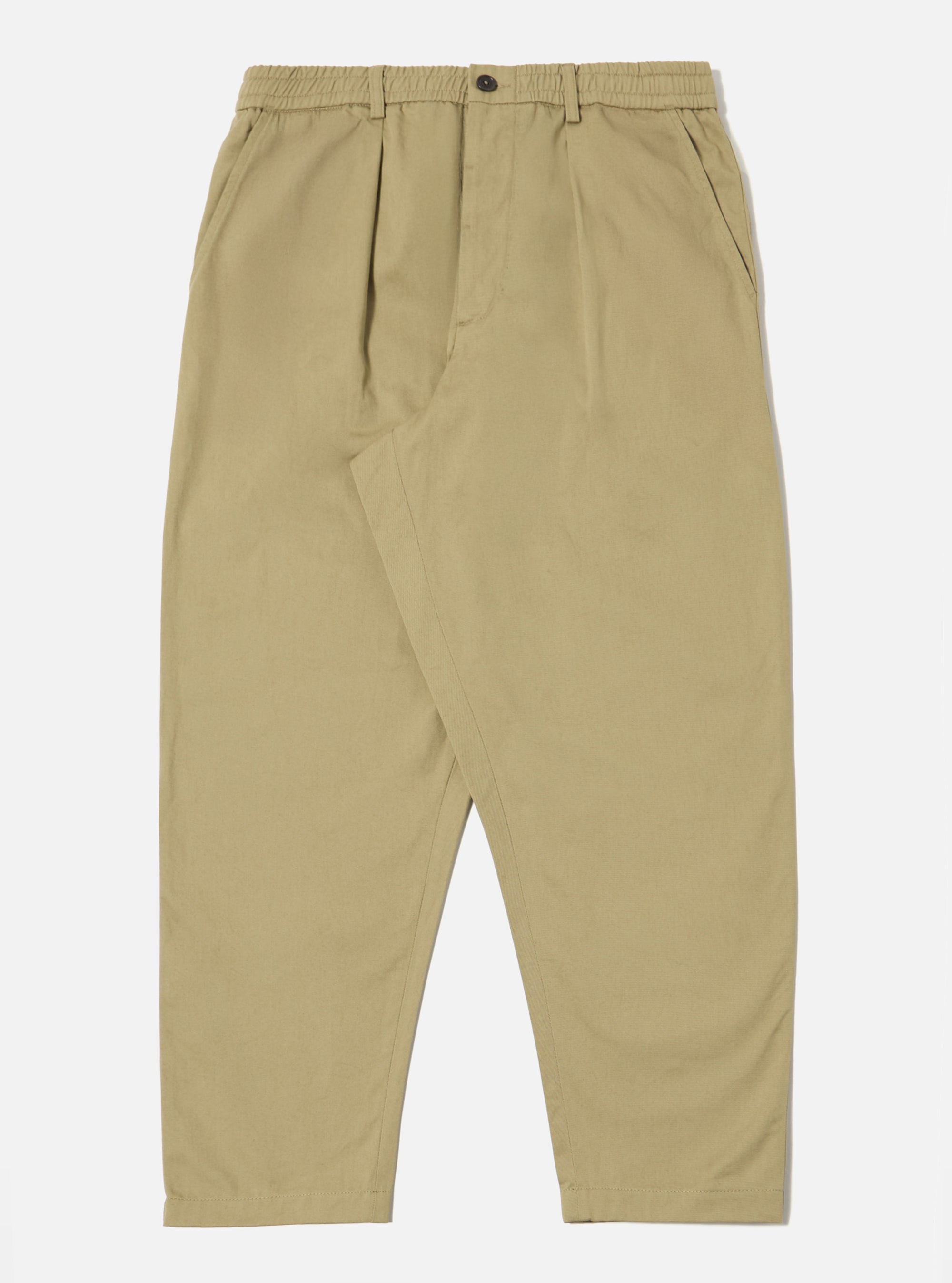 Studio shot of the Sand Twill Pleated Track Pant on a white background. The pants are a relaxed fit, made from twill, and feature pleats at the front.