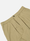 Close-up of the Sand Twill Pleated Track Pant on a white background. The sand-colored twill fabric shows pleats and an elastic waistband with a button closure.