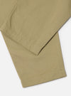 Close-up of the sand-colored Twill Pleated Track Pant on a white background, showing the fabric's texture and pleated design.