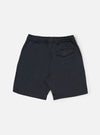 The Navy Twill Beach Short is shown from a rear angle, highlighting the two back patch pockets and the elasticated waistband. The shorts are laid flat against a clean, white background. The navy blue cotton twill fabric features visible stitching details around the pockets and hem.