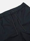 The Navy Twill Beach Short is shown from a rear angle as a flat lay against a plain white background. The back of the shorts features a single patch pocket on the right side and an elasticated waistband with visible stitching. The navy blue twill fabric has a smooth, durable appearance.