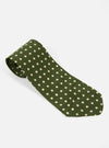 The Olive Dot Print Tie on a white surface. The tie is olive green with small white dots. The tie is rolled up at the top.