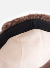 Close-up of the inside of a cableami® Olive Military Nylon Twill Boa Aviator hat. Features a soft, light-colored lining and a black band, against a plain white backdrop.