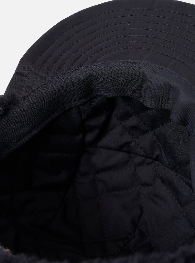 Close-up of the inside of a cableami® Black Military Nylon Twill Cap, showing the quilted lining and twill material. Shot on a white background.